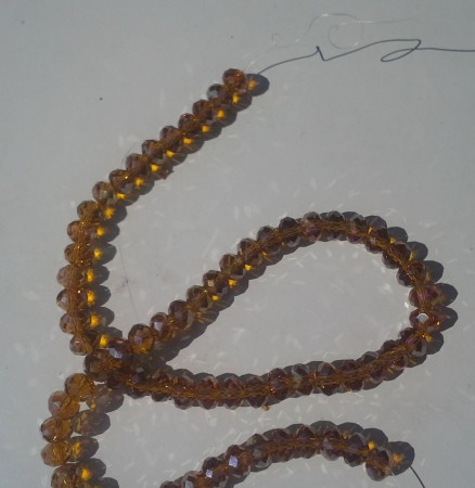 *AB lyster. Brun crystalpärlor. 6x8mm