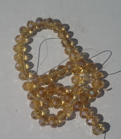 *AB lyster. Brun crystalpärlor. 6x8mm. 